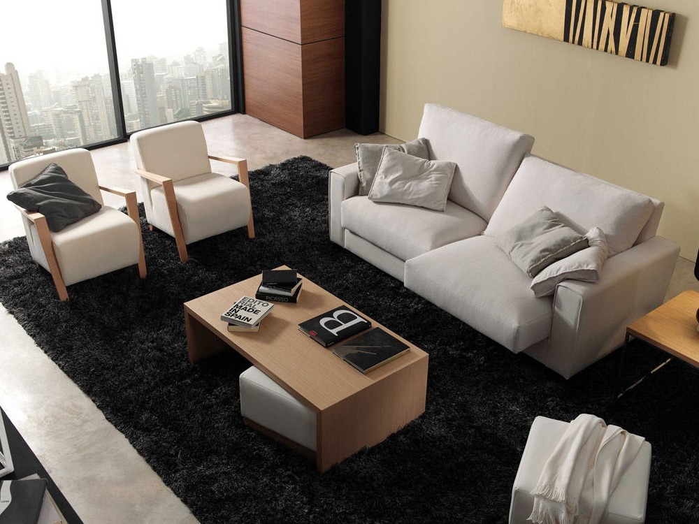 Sofá modular Egos con asientos deslizantes y respaldo envolvente. Ideal para ambientes modernos y equilibrados.