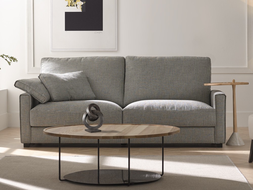 Sofá Egos con asientos deslizantes. Diseño actual, confort envolvente y tapizado personalizable en tejidos seleccionados.