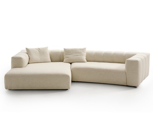 Sofá Doze con chaiselongue diseño envolvente y modular para espacios contemporáneos.