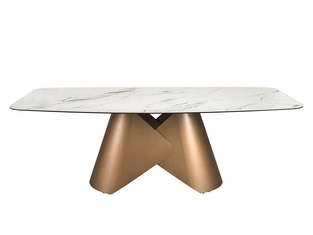 Combina el sobre en porcelánico blanco con base escultural de acero bronce, mesa 1172 de Ángel Cerdá