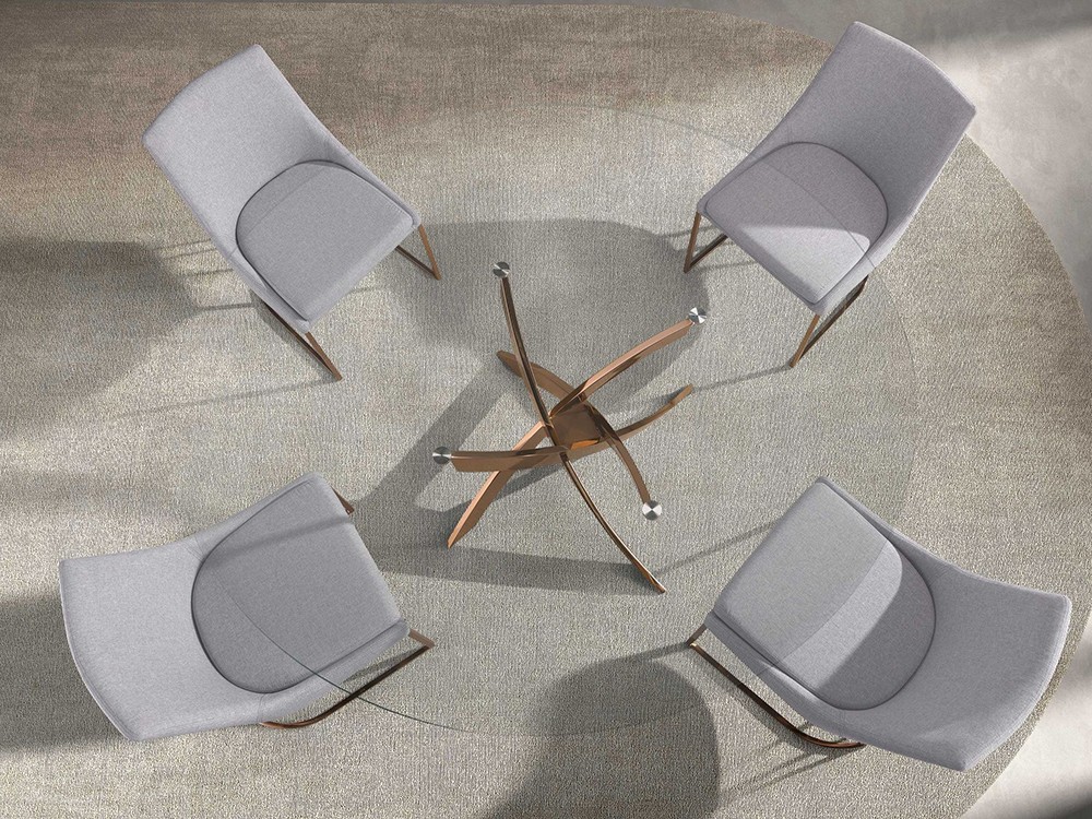 Mesa redonda fija que combina un sobre de cristal transparente y patas de acero dorado 1169 de Ángel Cerdá