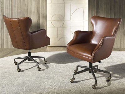 Sillón envolvente tapizado en piel natural marrón con tachuelas 4166 de Ángel Cerdá