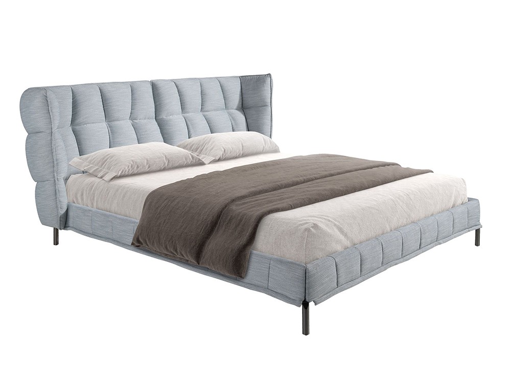 Cabecero de líneas envolventes tapizado en tejido gris azulado claro 7211 de Ángel Cerdá