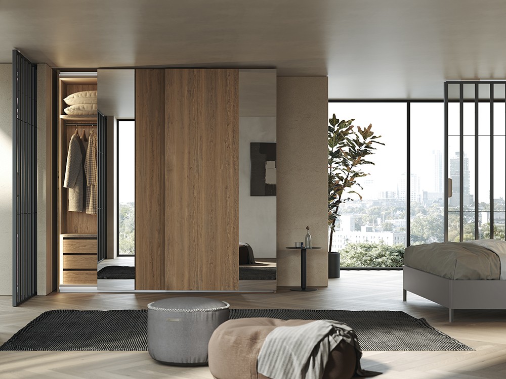 Armario a medida con puertas correderas exterior Duo con espejo y chapa de la colección Misura de García Sabaté