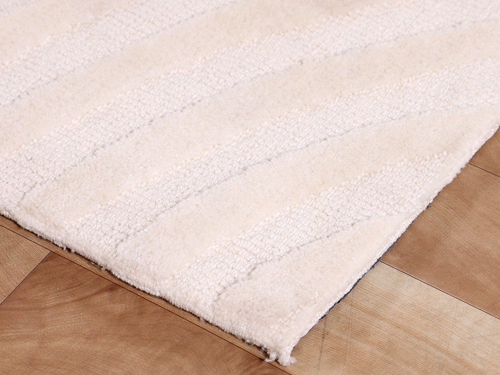 Alfombra de micropoliéster tejido circular en color marfil