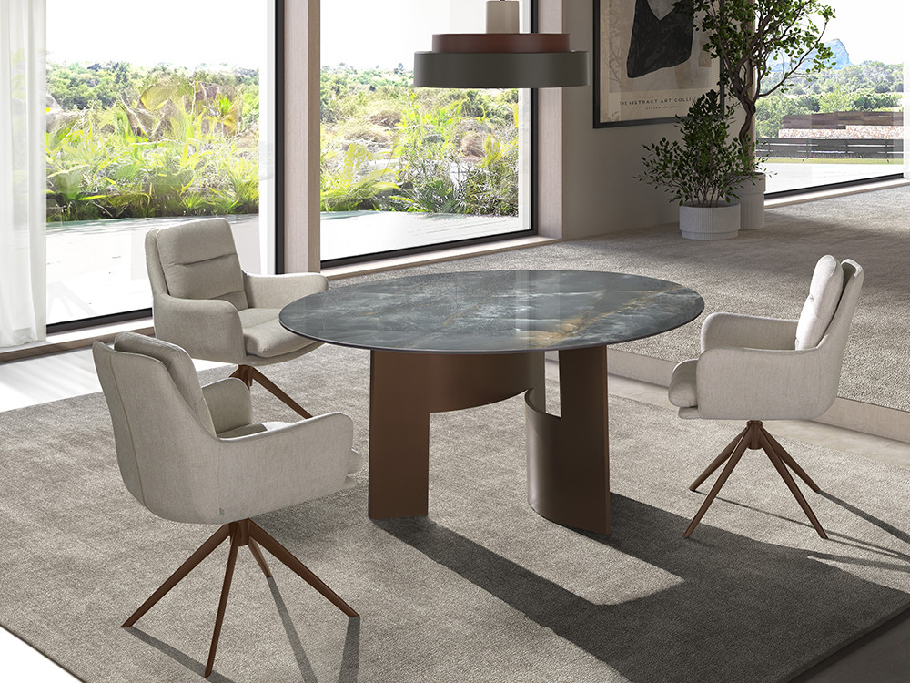 Mesa de comedor redonda Lambda A Keramic de Nacher: sobre porcelánico de 12mm y base escultórica de metal en Mobel 6000