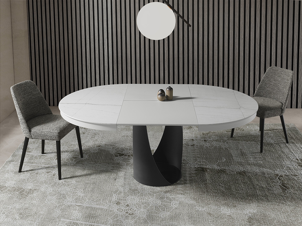 Visita Mobel 6000 en Madrid para elegir la mesa redonda extensible Frida. Base de acero y sobre porcelánico premium.