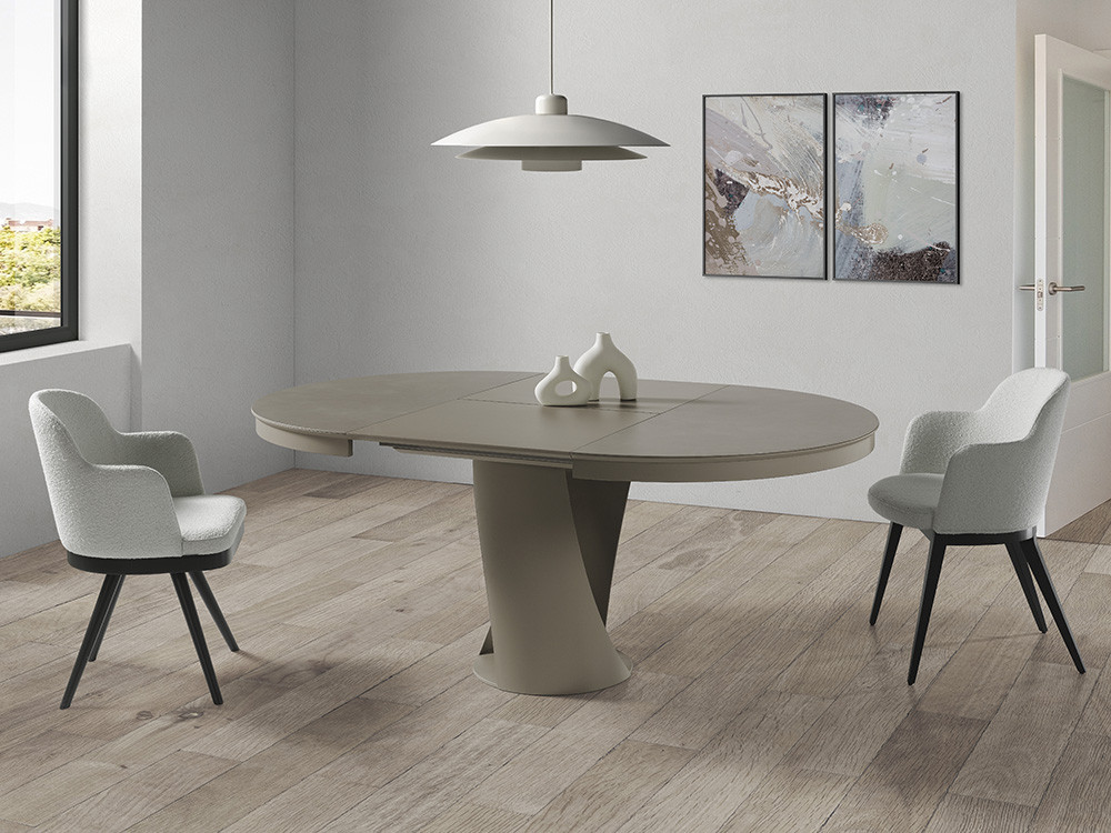 Tu hogar brillará con la mesa redonda extensible Frida. Sobre porcelánico y base escultórica de acero estilo premium.
