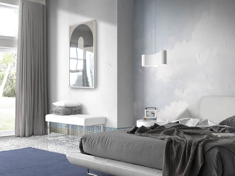 Banqueta descalzadora 5000 con pies de acero cromado, tapizada en polipiel blanca de la colección Harmony de Ángel Cerdá